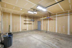 Garage featuring a garage door opener