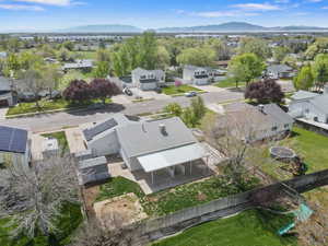Aerial perspective of suburban area with a mountain backdrop