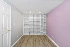 Interior space featuring wood finished floors and a textured ceiling