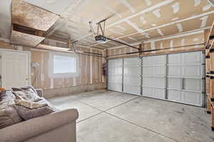 Garage featuring a garage door opener