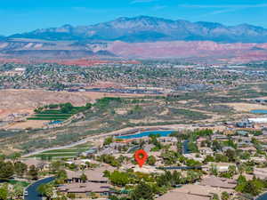 Aerial perspective of suburban area with a water and mountain view