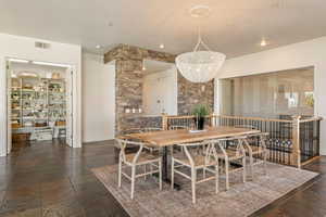 Dining room featuring stone tile floors