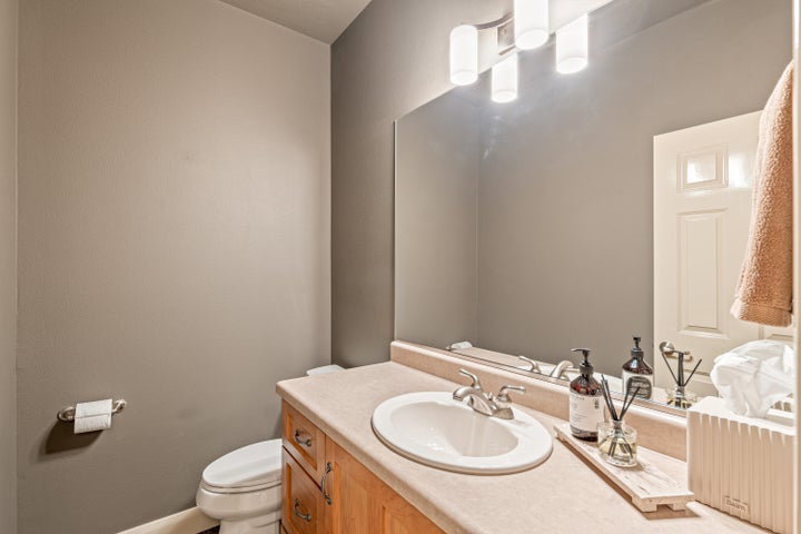 Half bath featuring vanity and toilet