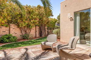 Fenced backyard with a patio area