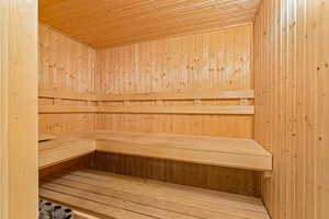 Sauna featuring wooden ceiling