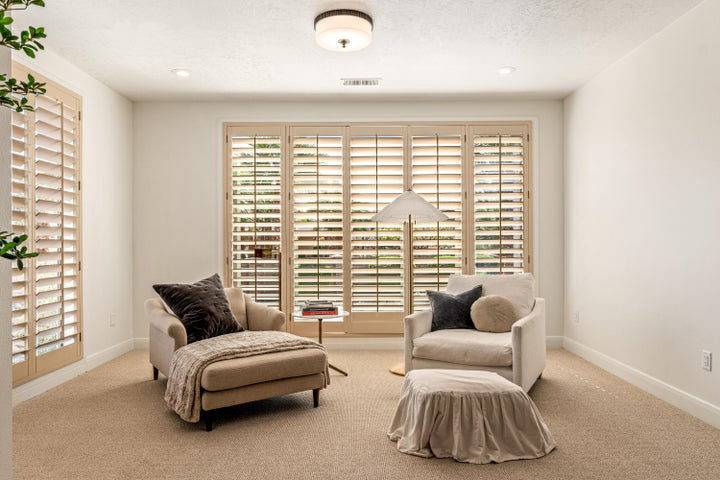 Living area featuring light colored carpet