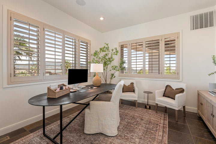 Office area with baseboards and recessed lighting