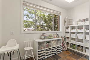 Sitting room featuring dark stone finish flooring