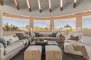 Sunroom / solarium with beamed ceiling