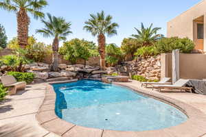 Integrated pool / spa featuring a patio area and a fenced backyard