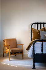 Living area featuring light colored carpet