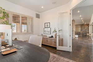 Office space featuring recessed lighting and lofted ceiling