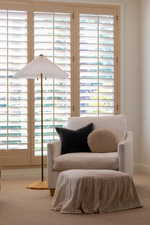 Sitting room with light colored carpet and plenty of natural light