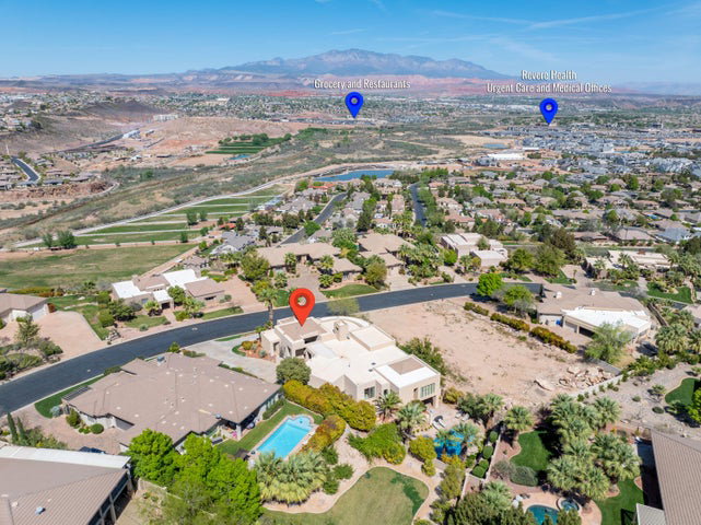 View of property location featuring a mountainous background and nearby suburban area