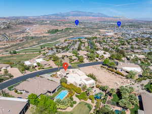 View of property location featuring a mountainous background and nearby suburban area