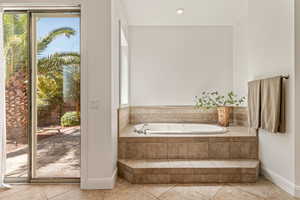 Full bathroom with a garden tub, light tile patterned flooring, and recessed lighting