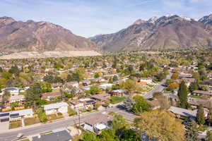Aerial perspective of suburban area with a mountainous background