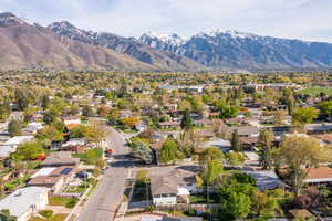 Aerial perspective of suburban area featuring a mountain backdrop