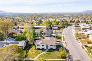 Aerial view of residential area featuring a mountainous background