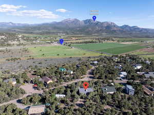 Aerial view of property's location with mountains and rural landscape