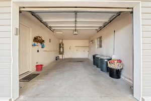 Garage featuring secured water heater
