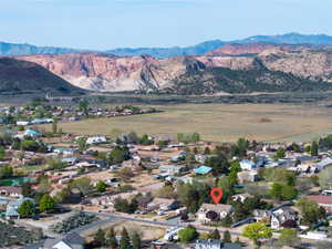 Aerial view of residential area featuring a mountainous background
