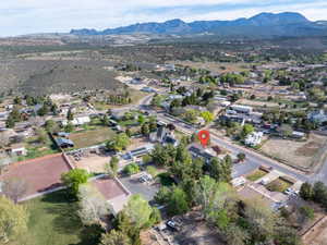 Aerial perspective of suburban area featuring a mountain backdrop