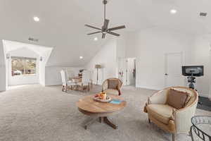 Sitting room with recessed lighting, a ceiling fan, carpet, and a high ceiling