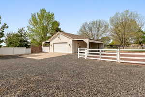 Garage featuring concrete driveway