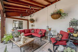 View of patio / terrace with outdoor furniture and a ceiling fan