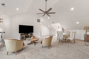 Living area with light colored carpet, recessed lighting, and ceiling fan