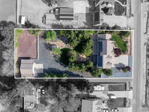 Aerial view of property and surrounding area featuring property parcel outlined