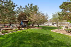 View of yard with a patio, a deck, and a gazebo