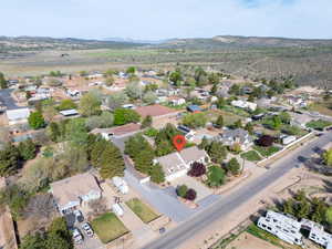 View of property location featuring nearby suburban area and a mountain backdrop