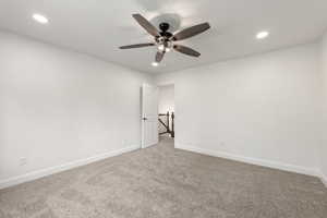 Unfurnished room featuring carpet, ceiling fan, and recessed lighting