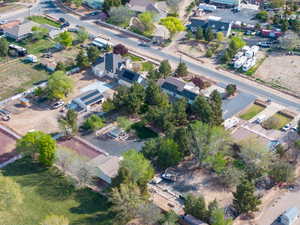 Aerial overview of property's location with nearby suburban area