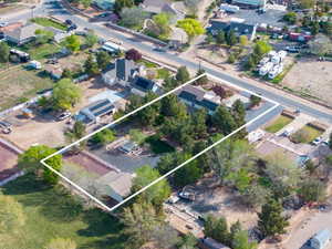 Aerial perspective of suburban area featuring property parcel outlined