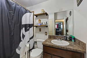 Full bathroom featuring a shower with curtain and vanity