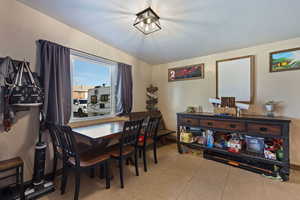 Dining space featuring baseboards and light tile patterned floors