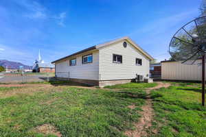 View of side of property featuring a mountain view