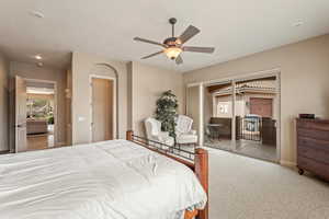 Bedroom featuring light colored carpet, access to exterior, ceiling fan, and recessed lighting