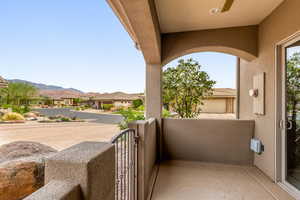 Balcony featuring a residential view and a mountain view