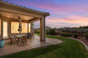 View of patio featuring a ceiling fan and outdoor dining area