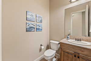 Bathroom with vanity and a textured wall