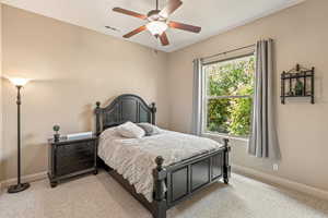 Bedroom featuring carpet flooring and a ceiling fan