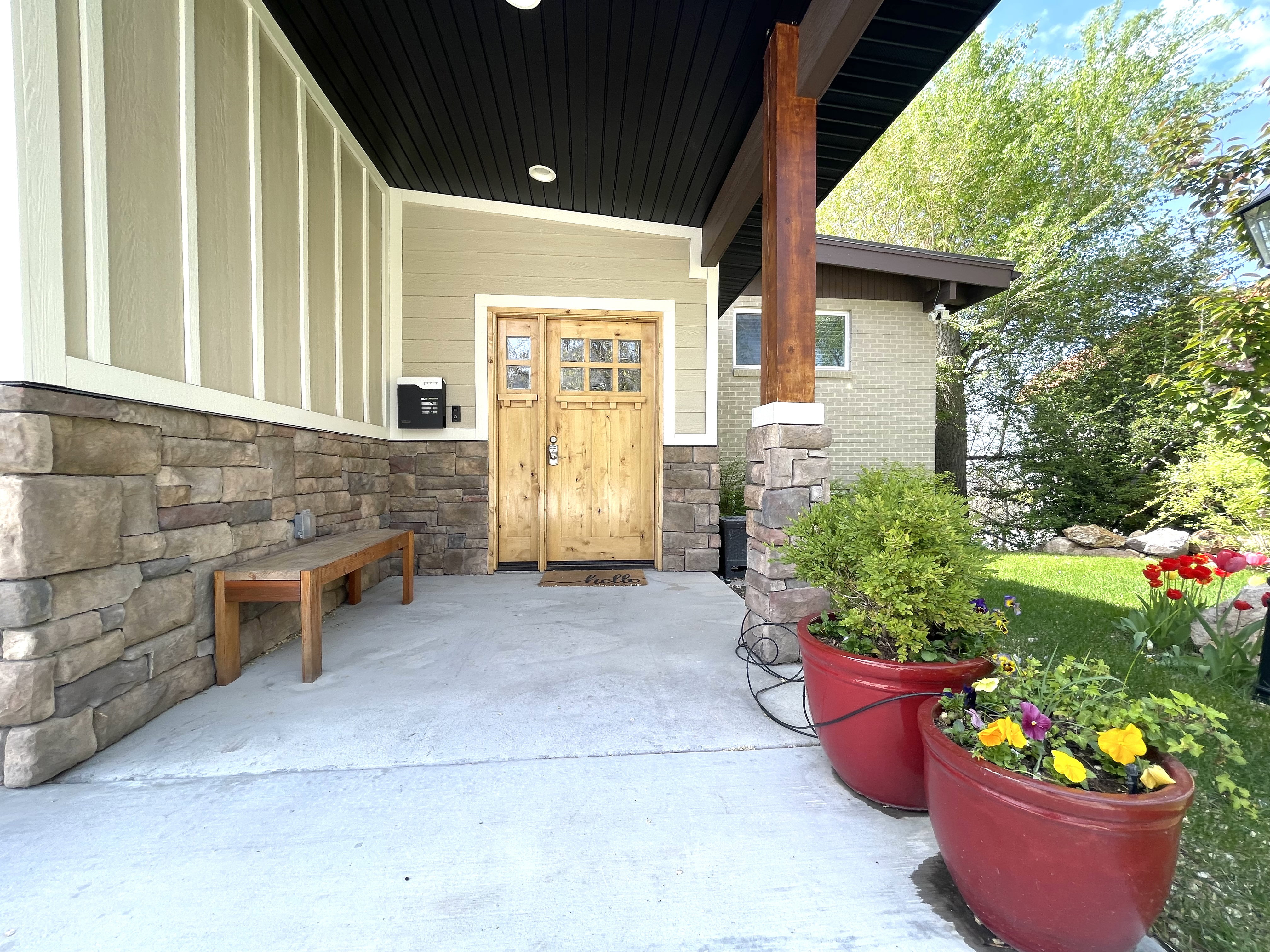 Entrance to property with stone siding