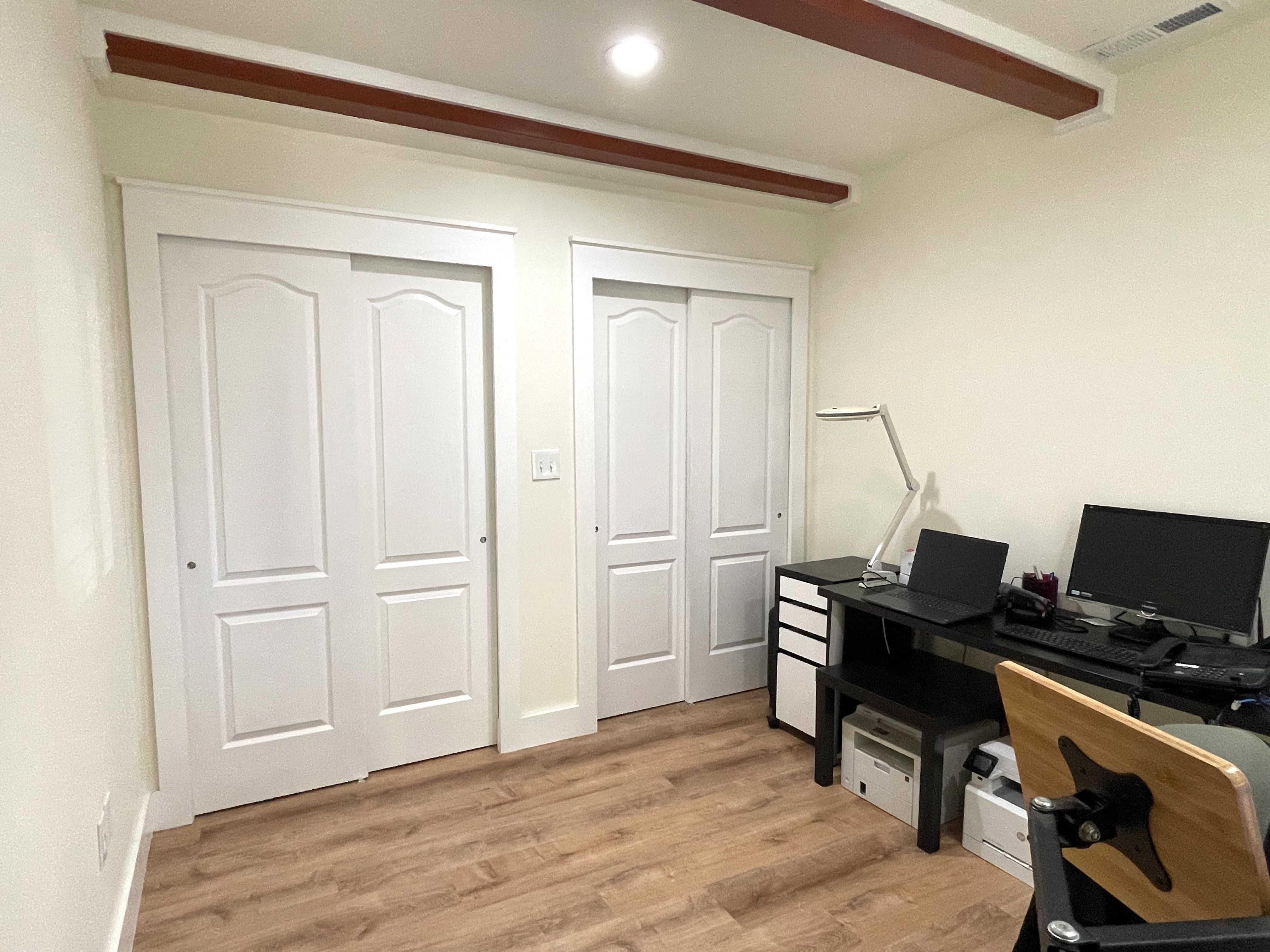 Office featuring light wood-style flooring, beamed ceiling, and recessed lighting