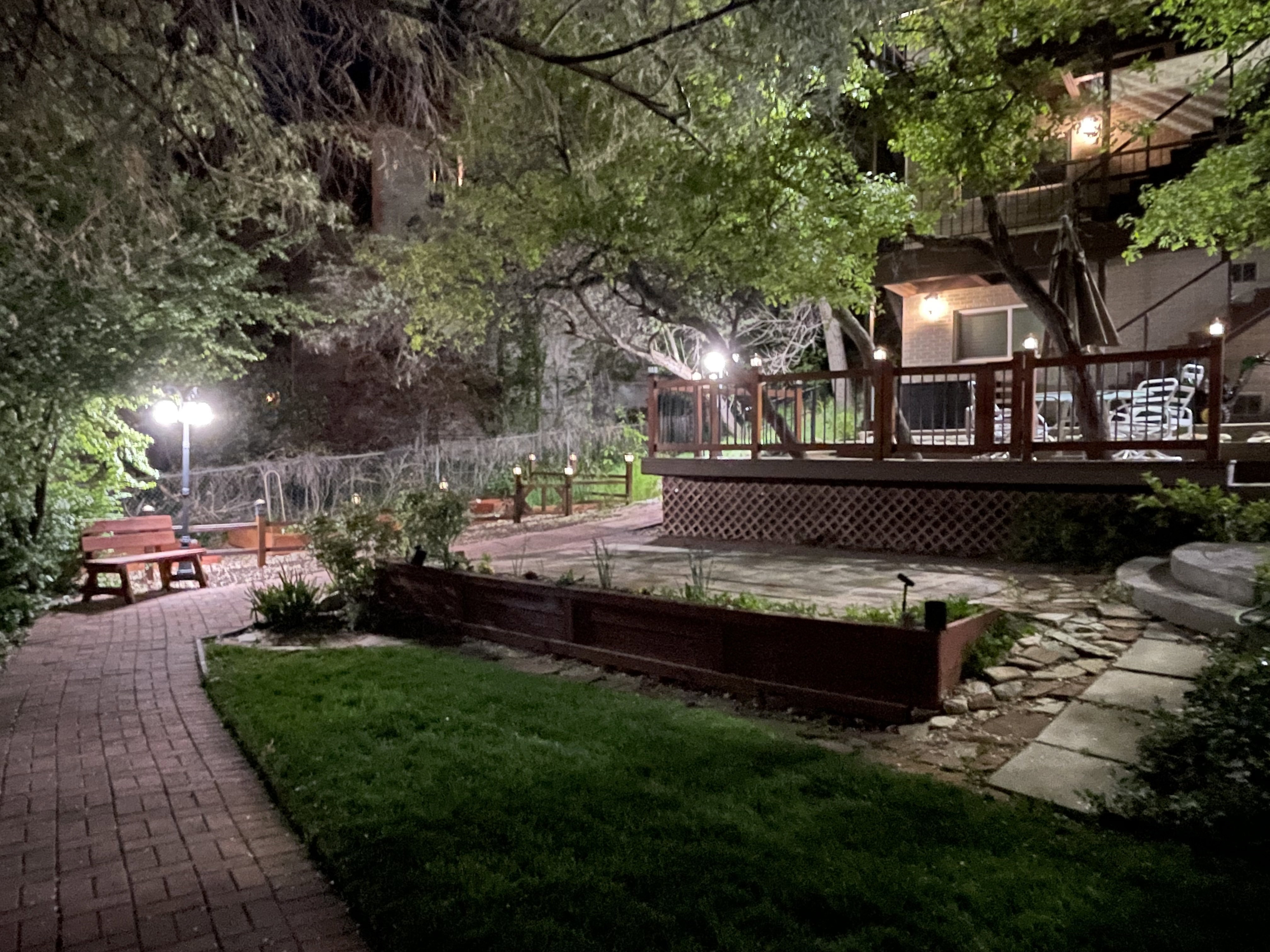 View of home's community featuring a wooden deck and a patio