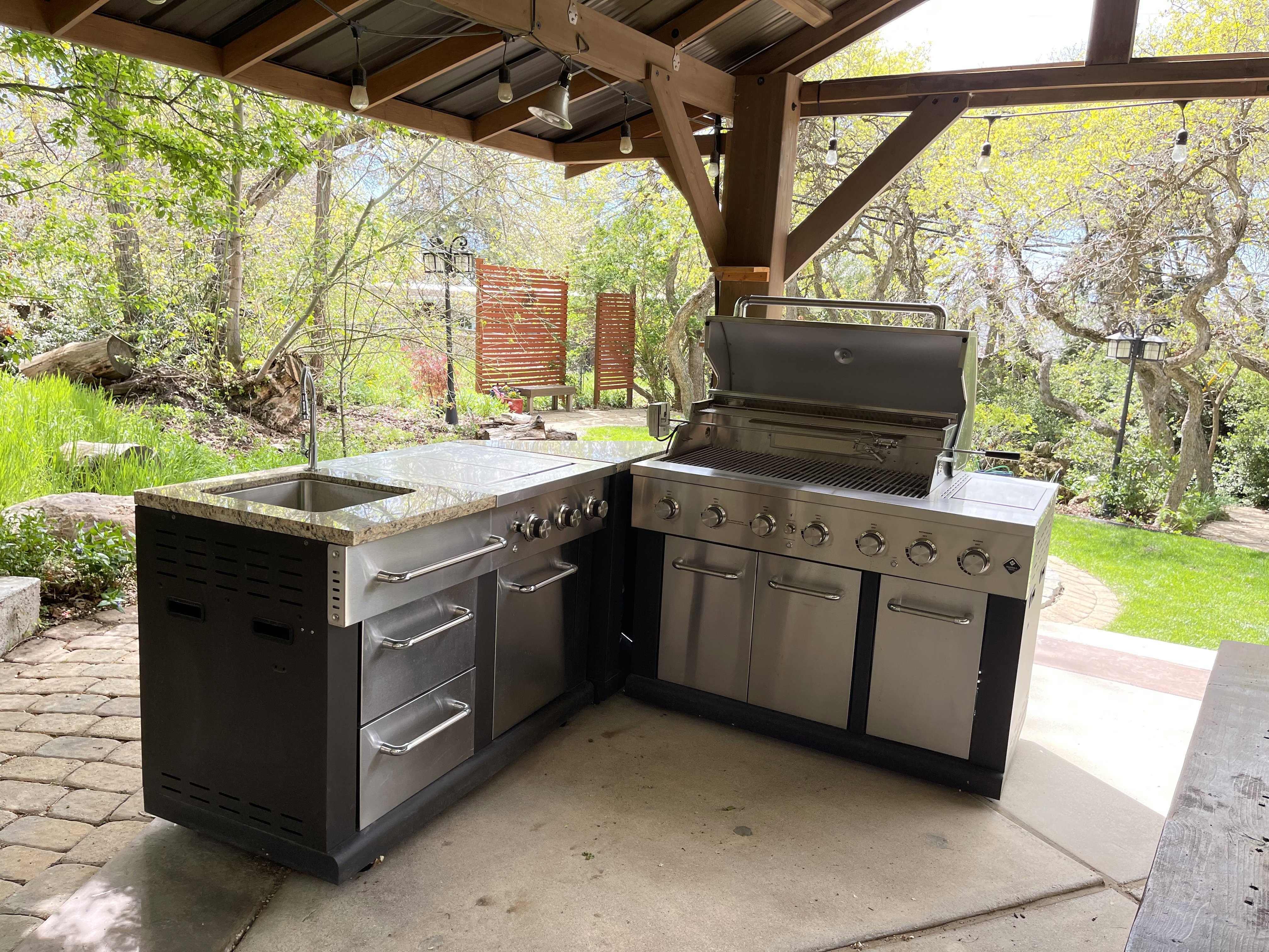 View of patio with area for grilling and a sink