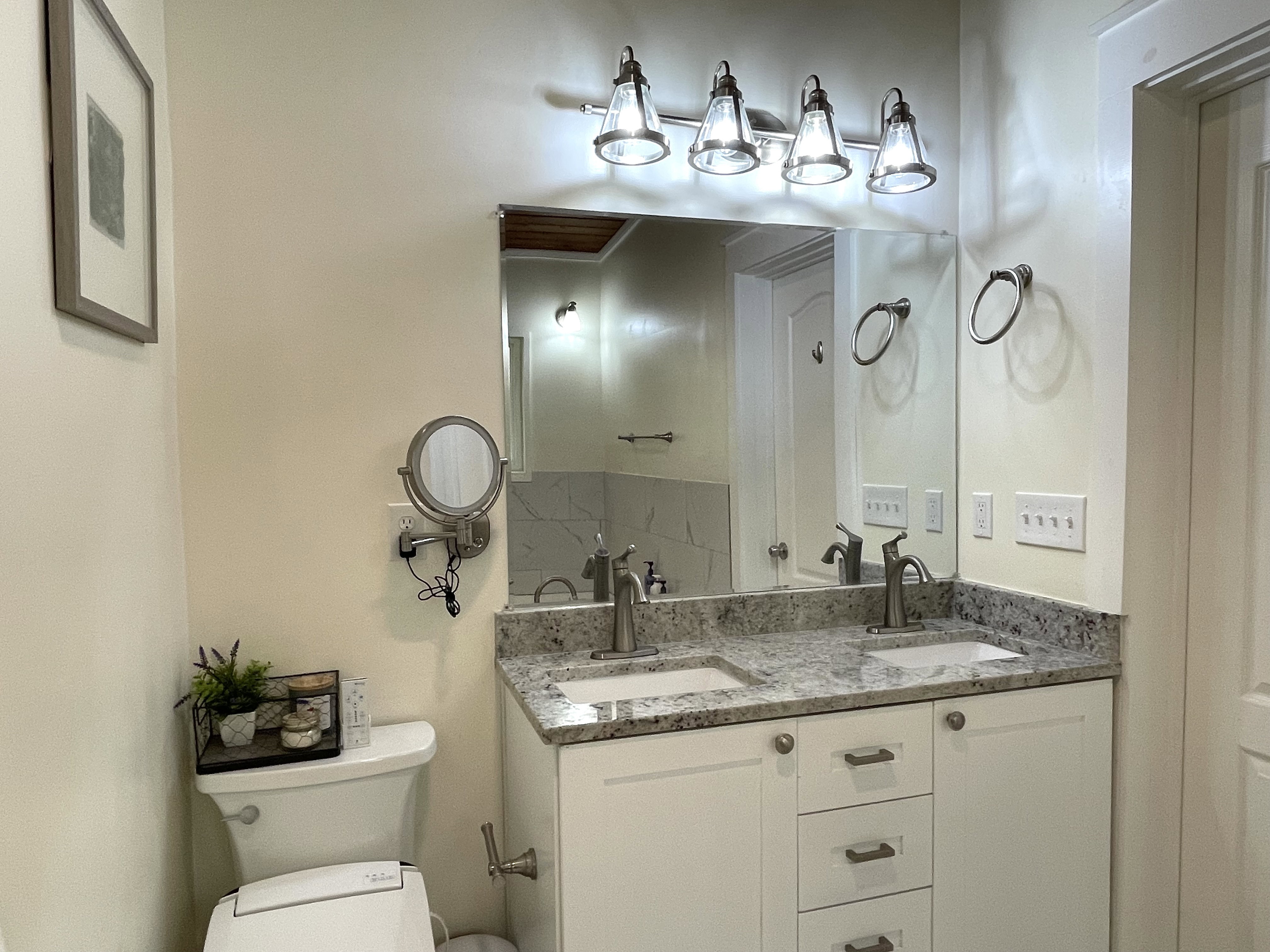 Bathroom with double vanity and toilet